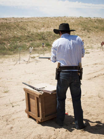 2012 annual match of Colorado Shaketails Cowboy Action Shooting SASS Club.  The firearms used are based on those which existed in the 19th century American West, i.e. lever action rifle, single action revolver, and shotgun.のeditorial素材