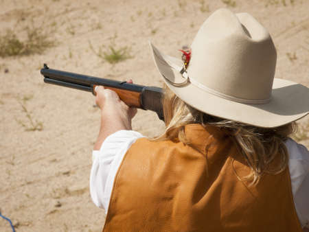 2012 annual match of Colorado Shaketails Cowboy Action Shooting SASS Club.  The firearms used are based on those which existed in the 19th century American West, i.e. lever action rifle, single action revolver, and shotgun.の写真素材