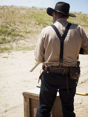 2012 annual match of Colorado Shaketails Cowboy Action Shooting SASS Club.  The firearms used are based on those which existed in the 19th century American West, i.e. lever action rifle, single action revolver, and shotgun.の写真素材