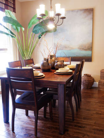 Modern dining room with table set for family dinner.のeditorial素材