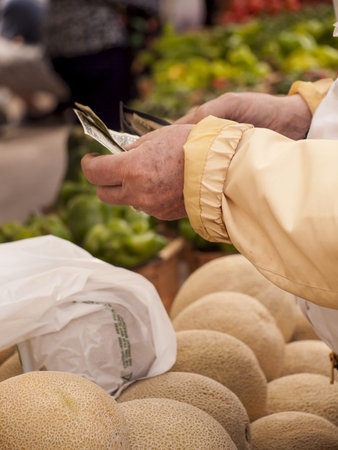 Fresh cantaloupe at the local farmers market. Farmers markets are a traditional way of selling agricultural products.の写真素材