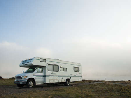 Motorhome campsite near the lake on early morning late in the season.のeditorial素材