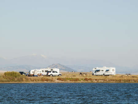 Motorhome campsite near the lake on early morning late in the season.のeditorial素材