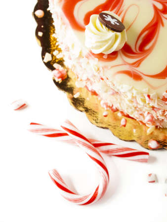 Traditional Christmas White Chocolate Peppermint Cheesecake on white background.の写真素材