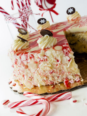 Traditional Christmas White Chocolate Peppermint Cheesecake on white background.