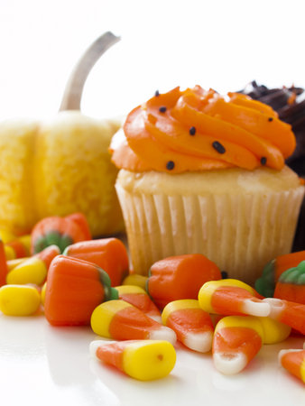 Halloween orange and black cupcakes on white background.の写真素材