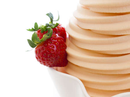 Cup of soft-serve frozen yogurt on white background.の写真素材