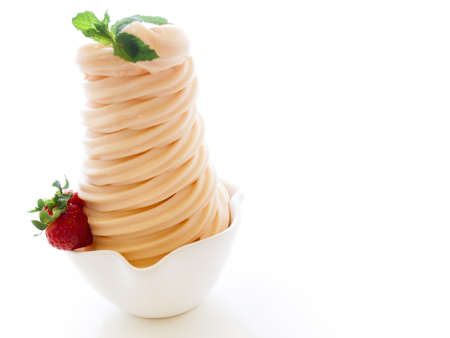 Cup of soft-serve frozen yogurt on white background.の写真素材