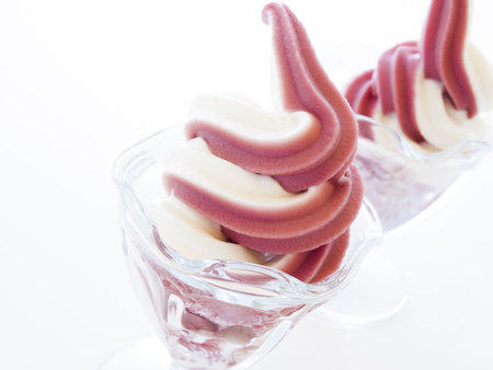 Cup of soft-serve frozen yogurt on white background.の写真素材