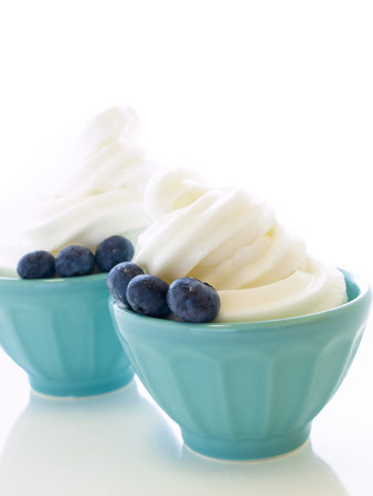 Cup of soft-serve frozen yogurt on white background.の写真素材