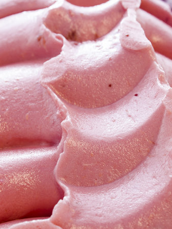 Gourmet sweet orange and cranberry gelato on white background.
