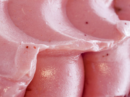 Gourmet sweet orange and cranberry gelato on white background.