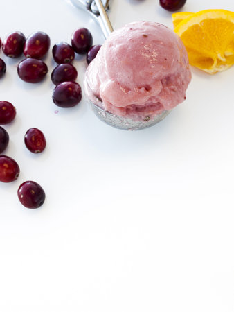 Gourmet sweet orange and cranberry gelato on white background.の写真素材