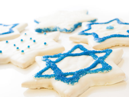 Gourmet cookies decorated with white icing for Hanukkah.
