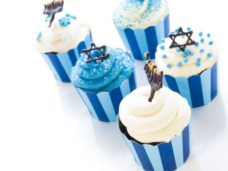 Gourmet cupcakes decorated with white and blue icing for Hanukkah.の写真素材