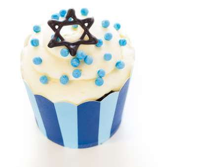 Gourmet cupcakes decorated with white and blue icing for Hanukkah.の写真素材