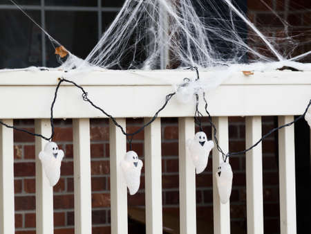Halloween decorations in the front yard of a house on Halloween.の写真素材