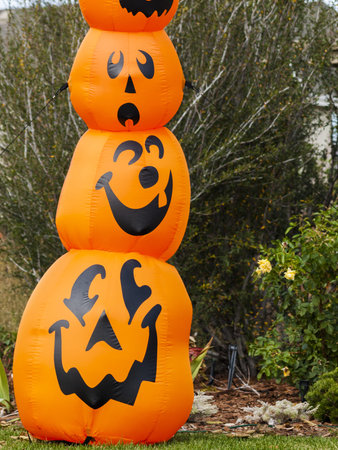 Halloween decorations in the front yard of a house on Halloween.