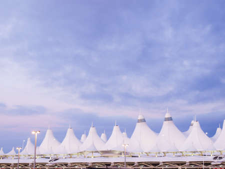Denver International Airport at dusk with cloudy sky.のeditorial素材