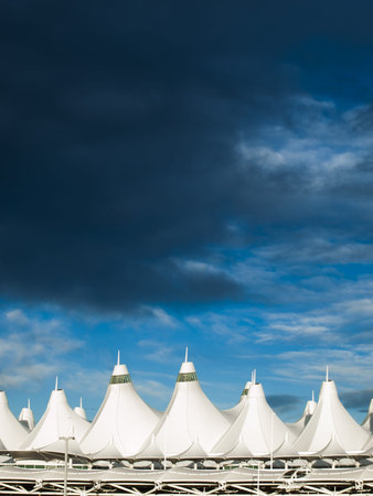 Denver International Airport at dusk with cloudy sky.のeditorial素材