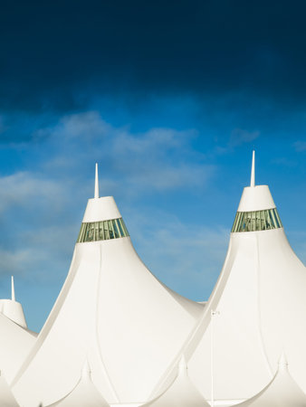 Denver International Airport at dusk with cloudy sky.のeditorial素材
