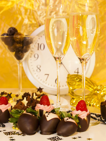 Gourmet assorted petite party pastries decorated for New Year Eve celebration.の写真素材