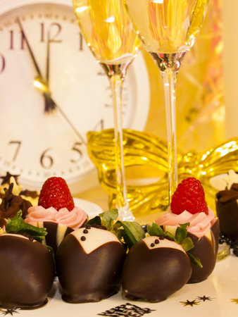 Gourmet assorted petite party pastries decorated for New Year Eve celebration.の写真素材