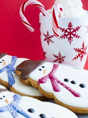Hot chocolate with peppermint canes and snowman sugar cookies.の写真素材