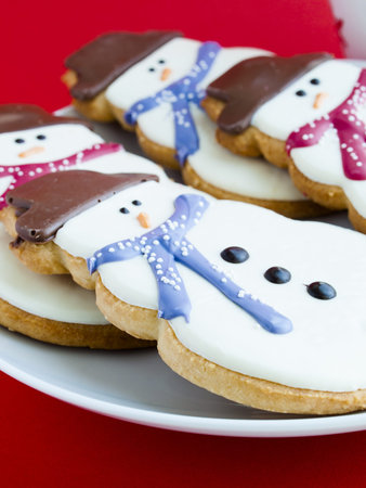 Hot chocolate with peppermint canes and snowman sugar cookies.