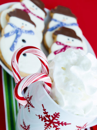 Hot chocolate with peppermint canes and snowman sugar cookies.