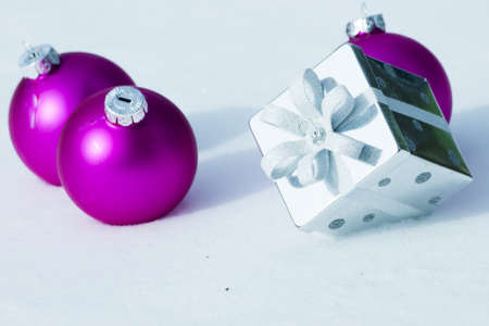 Christmas ornaments in virgin snow.の写真素材
