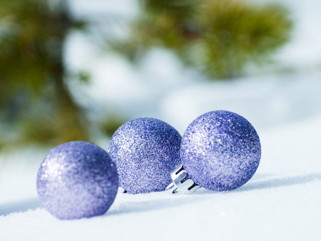 Christmas ornaments in virgin snow.の写真素材