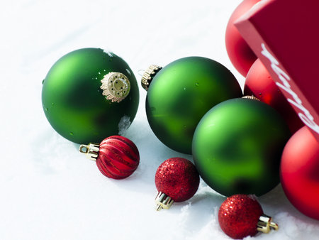 Christmas ornaments in virgin snow.の写真素材