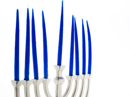 Contemporary menorah with blue candels on white background.の写真素材