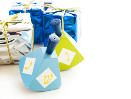 Colorful dreidels on white background.の写真素材