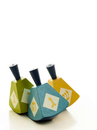 Colorful dreidels on white background.の写真素材