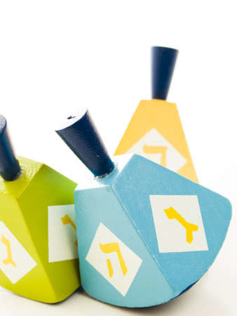 Colorful dreidels on white background.の写真素材