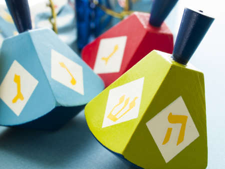 Colorful dreidels on blue background.の写真素材