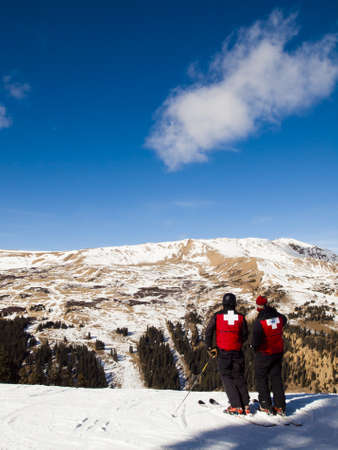 Ski patrol in red jackets on top of Loveland Ski Basin.のeditorial素材