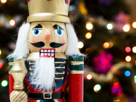 Nutcracker with Christmas tree in the backgound.の写真素材