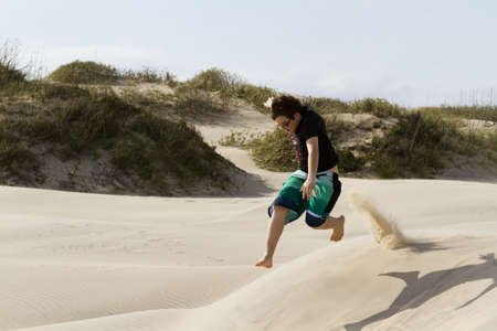 Having fun on coastal dunes of South Padre Island, TX.のeditorial素材