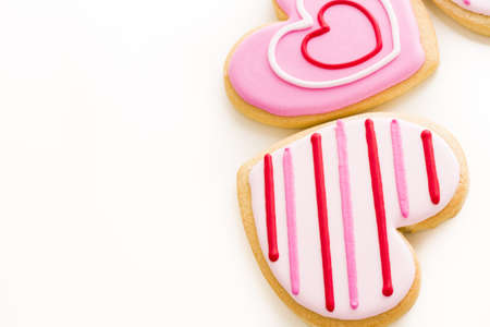 Heart shaped cookies decorated fancy icing patterns.の写真素材