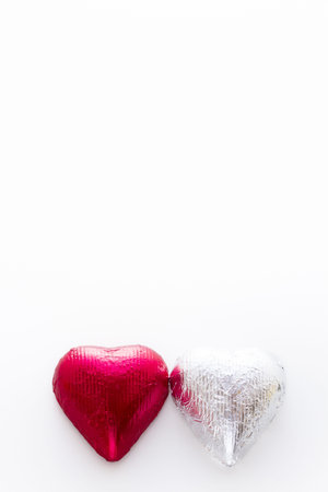 Heart shape chocolate candies wrapped in colorful foil for Valentine's Day.