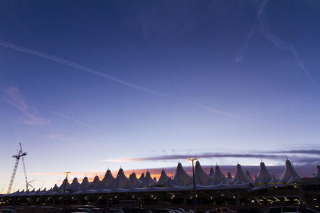 Tents of DIA at sunrise. Denver International Airport well known for peaked roof. Design of roof is reflecting snow-capped mountains.のeditorial素材