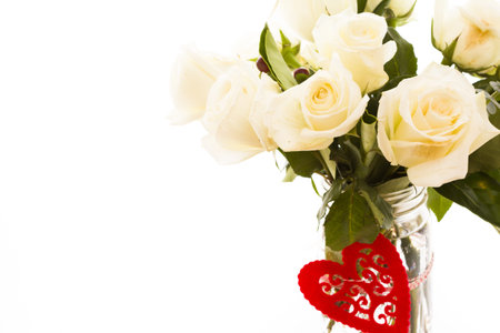 Gourmet cookies with bouquet of white roses.の写真素材