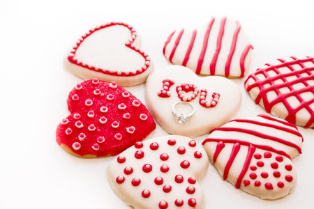 Gourtmet heart shaped cookies decorated for Valentine's Day.