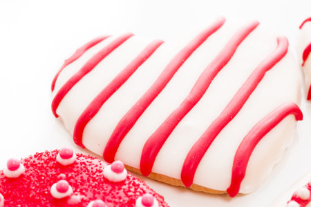Gourtmet heart shaped cookies decorated for Valentine's Day.