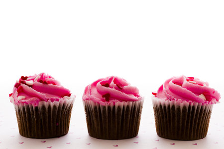 Chocolate cupcake with pink icing decorated for Valentine's Day.