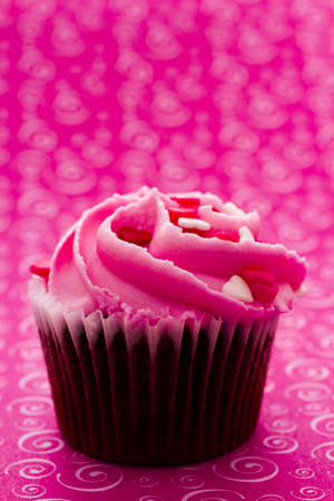 Chocolate cupcake with pink icing decorated for Valentine's Day.の写真素材