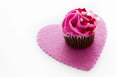 Chocolate cupcake with pink icing decorated for Valentine's Day.の写真素材